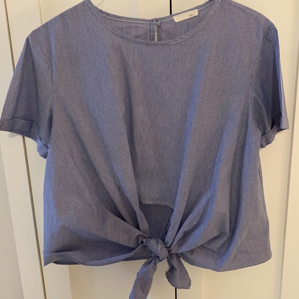 LOWER PRICE!!! Women’s navy/white striped top. Tied in a know in the front.